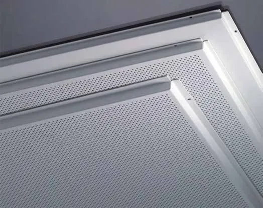Perforated FERREX lay-in ceiling tile with a plain border, seen from below