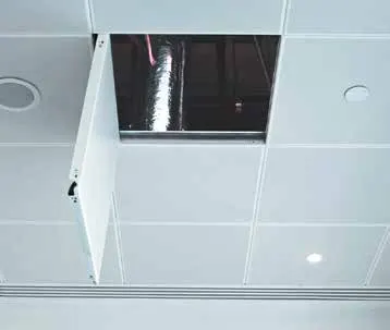 Metal ceiling with one panel opened downward to reach the ductwork above